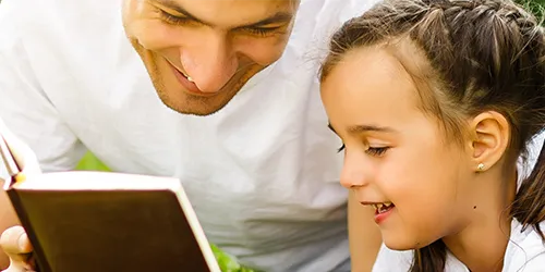 Man reading with child