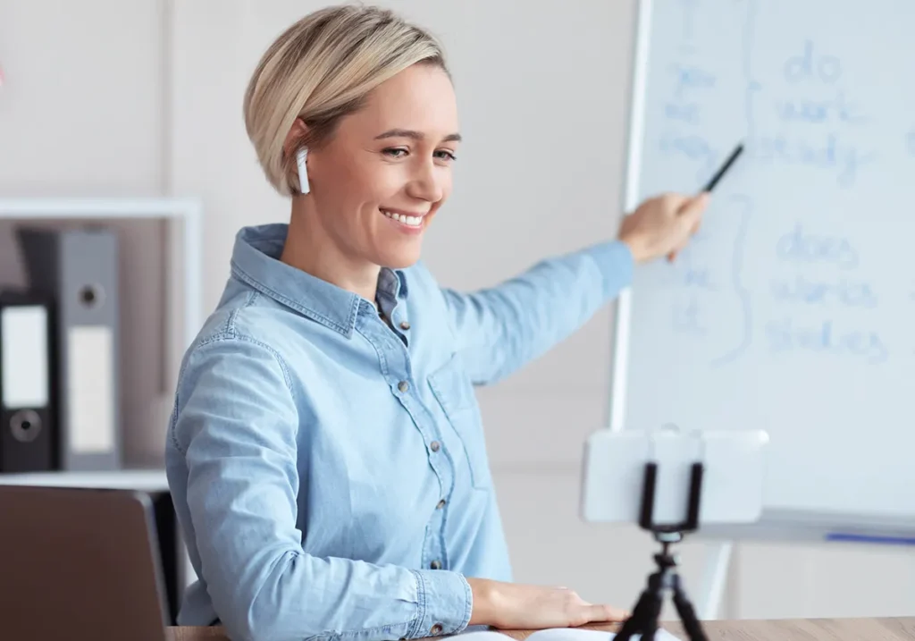 woman pointing at a whiteboard