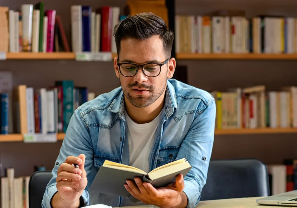 man reading in computer